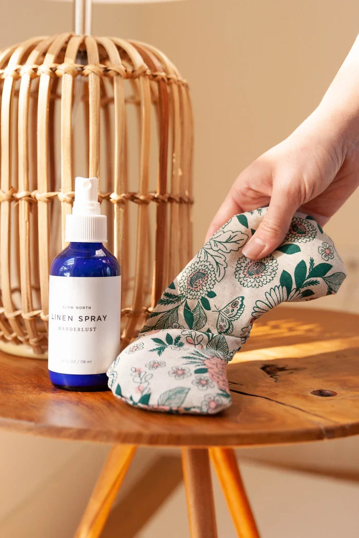 Hidden Falls Migraine Mask shown with a linen spray