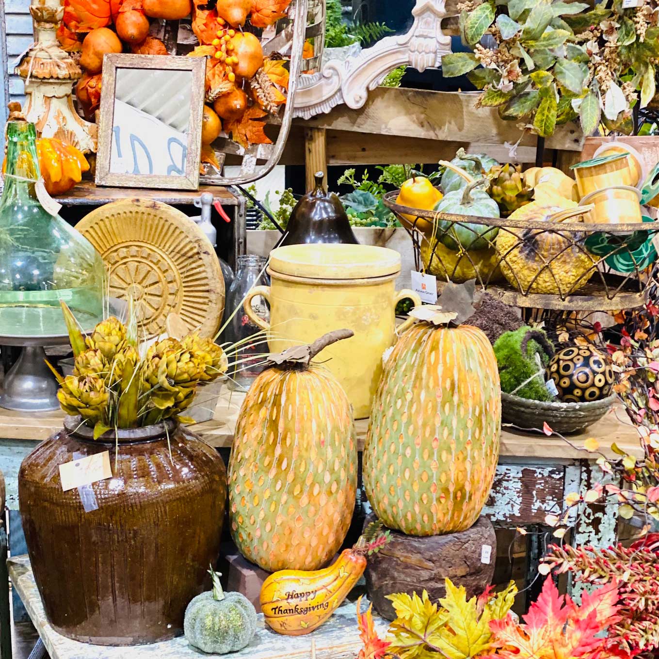 Image of variety of colorful gourds, knick knacks, and other decor items for a Fall flavor at Frisco Mercantile
