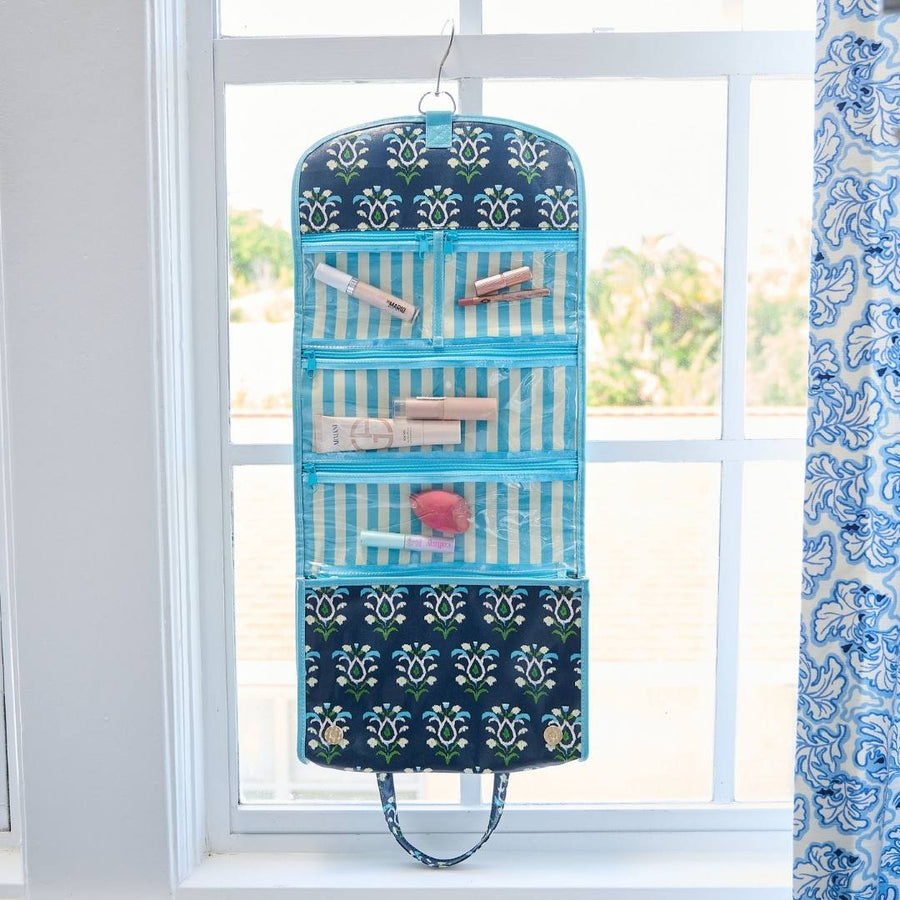 Rosemary Indigo Hanging Travel Case has 4 clear zip compartments