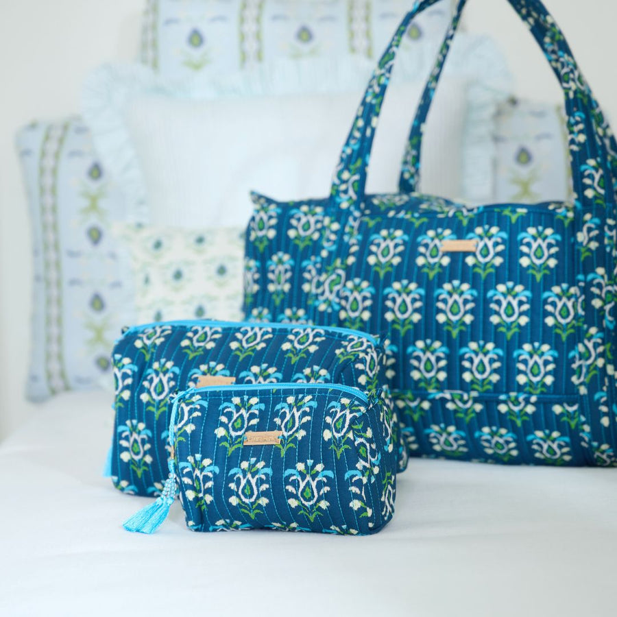 Rosemary Indigo Signature Large Cosmetic Bag shown with other bags in collection