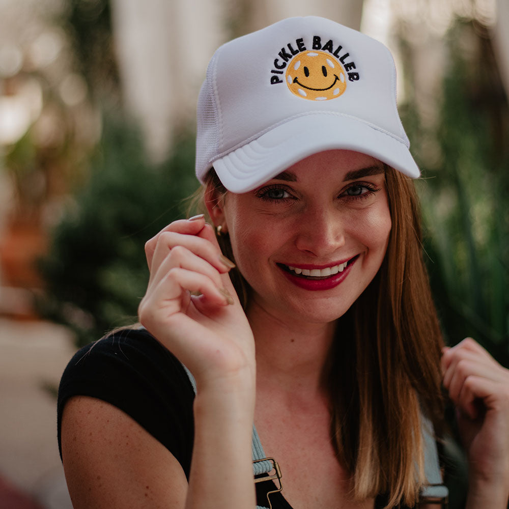 Pickle Baller Foam Trucker Hat with smiling happy face emoji in black and white