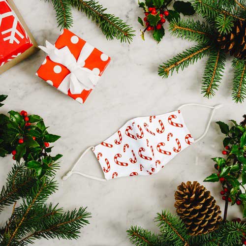 Candy Canes kid&#39;s face mask with red candy canes under Christmas tree