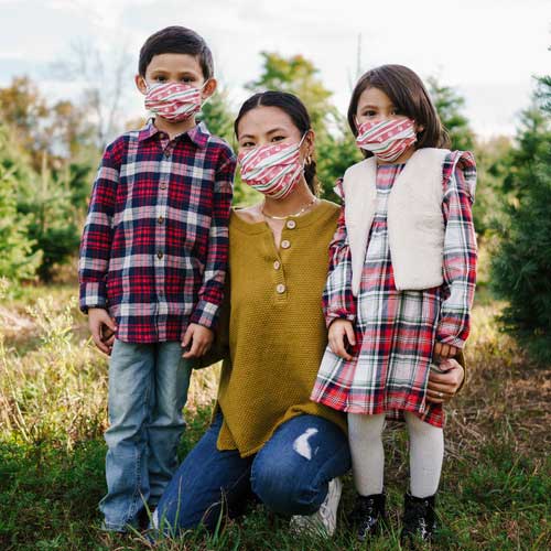 Holiday Paws Kid&#39;s Face Mask disposable with paw prints on red ribbon family wearing masks
