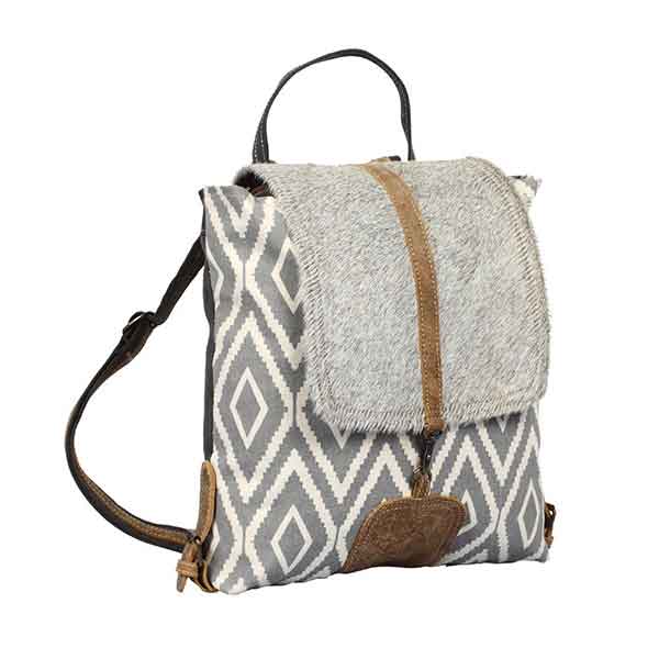 Artist Impression Backpack Bag of upcycled canvas with hairon flap from Myra Bag angled view