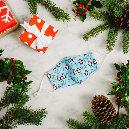 Penguins &amp; Lights kid&#39;s mask with Penguins wearing caps stringing Christmas lights mask under tree