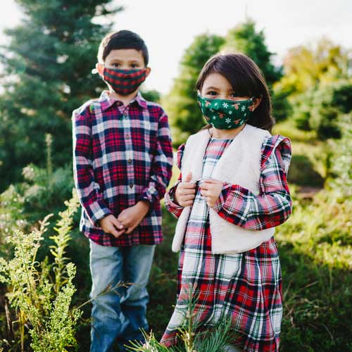 Reindeers &amp; Snowflakes kid&#39;s face mask red-nose reindeers and snowflakes young children outdoors