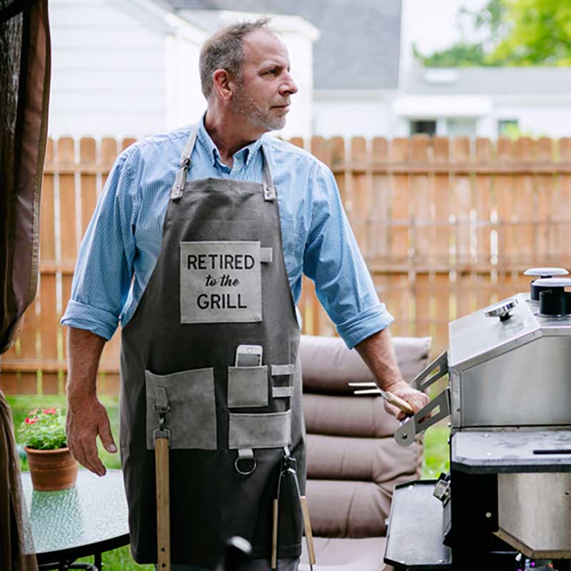 Retired To The Grill grillng apron showing man at grill