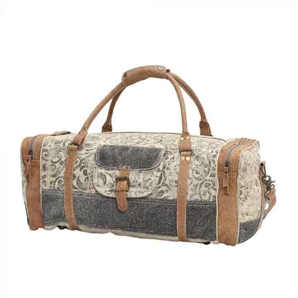 Floral print & hairon traveler bag with zippered compartments from Myra Bag front view