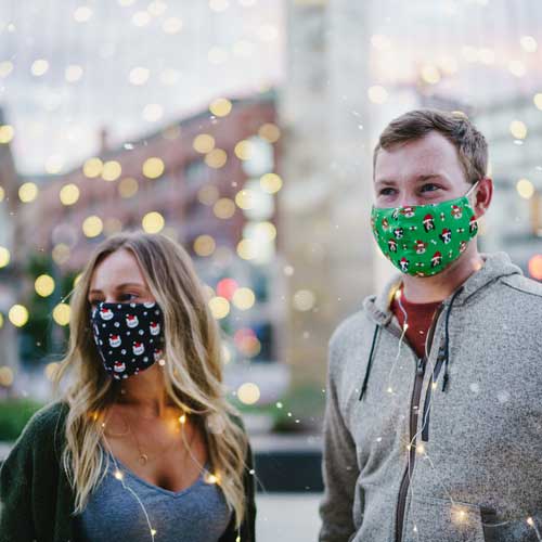 Santa Dog adult holiday mask with dogs in red caps couple in masks