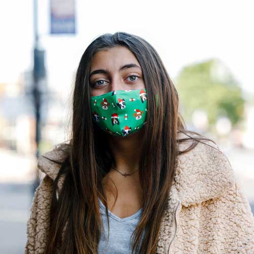 Santa Dog Kid&#39;s Mask with dogs in red caps and bones teenager wearing mask