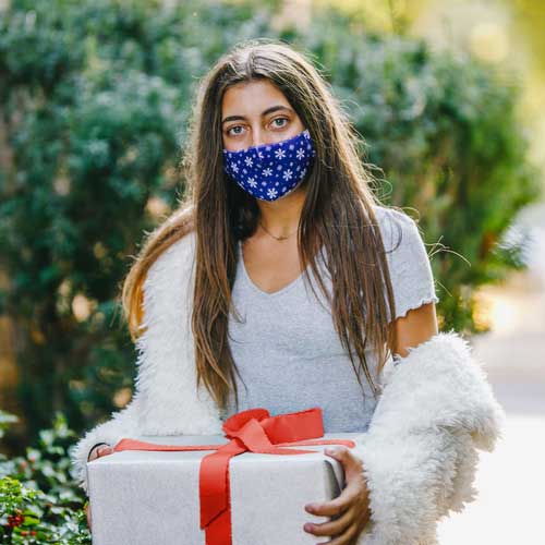Snowflakes kid&#39;s face mask with snwoflakes on blue background teenager with gift