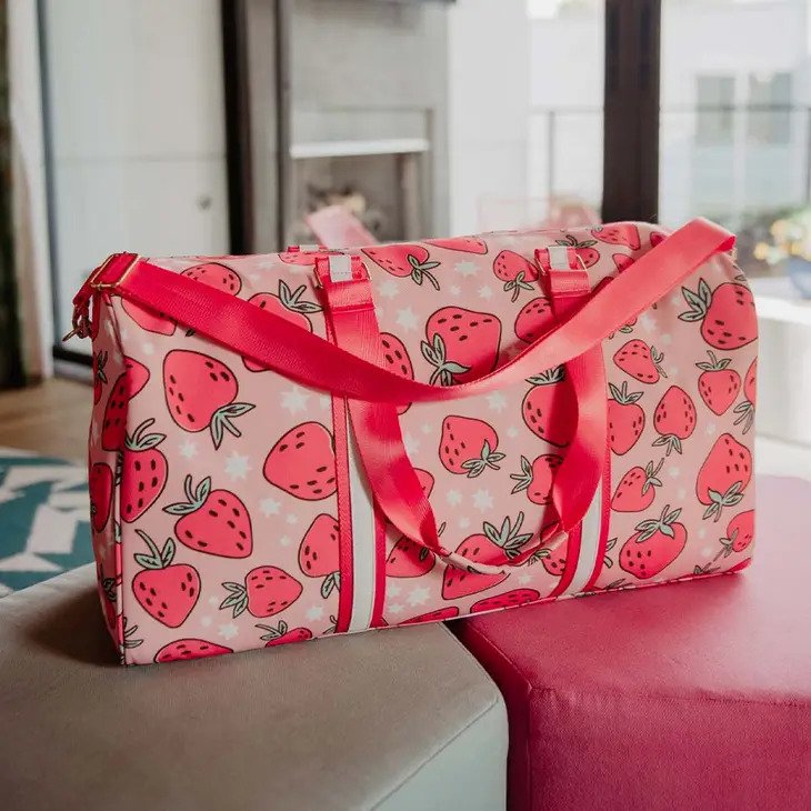 Strawberry Weekender Bag with whimsical white stars, has shoulder strap and carry handles
