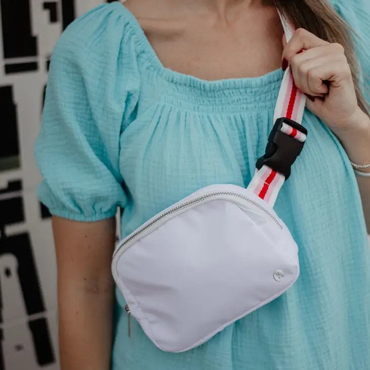 White Solid Belt Bag with Striped Strap with pink, red, and white striped strap
