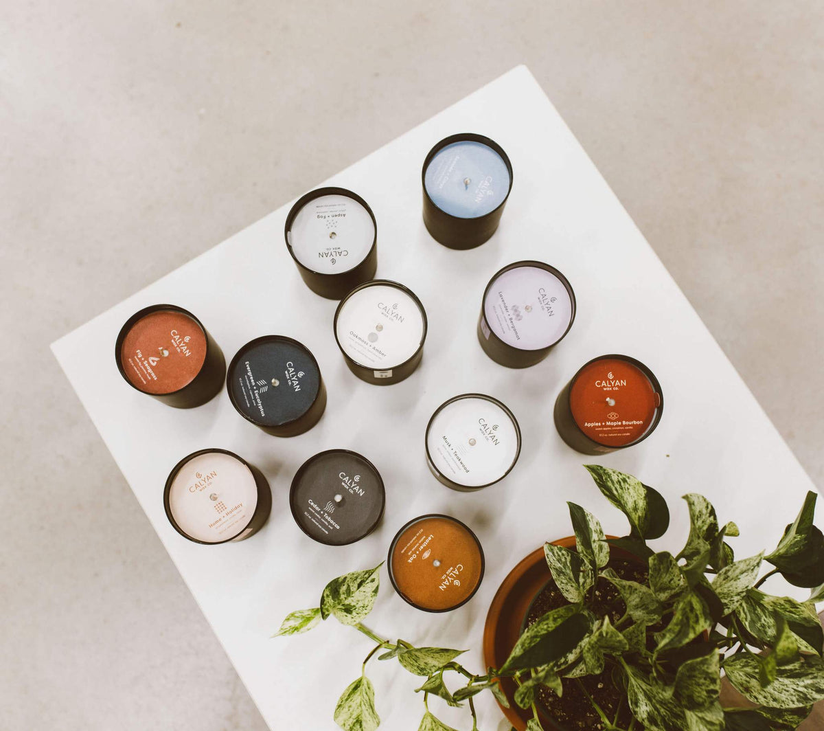 Collection of black matte glass tumbler candles from Calyan Wax Co.