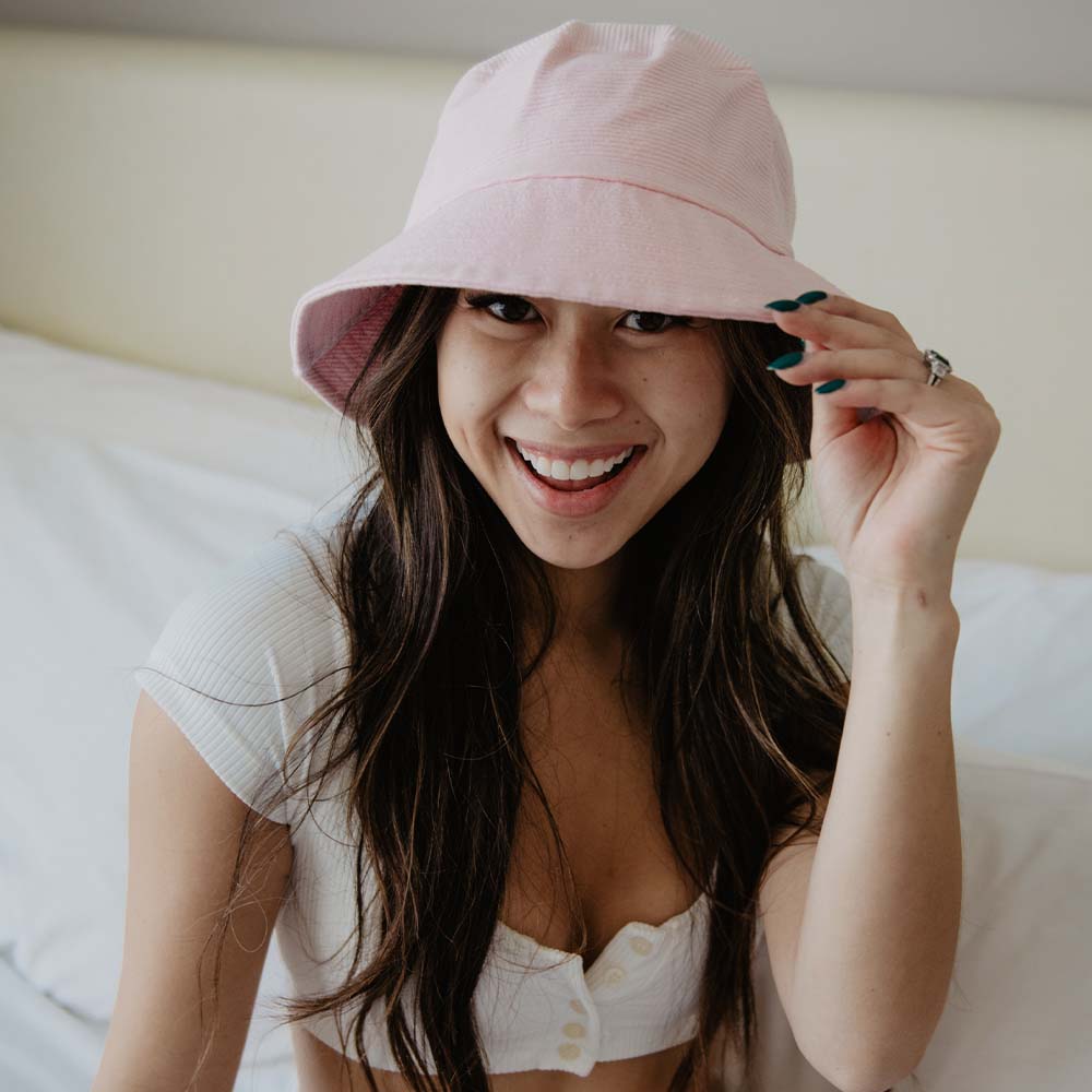Light Pink Corded Bucket Hat worn by young woman